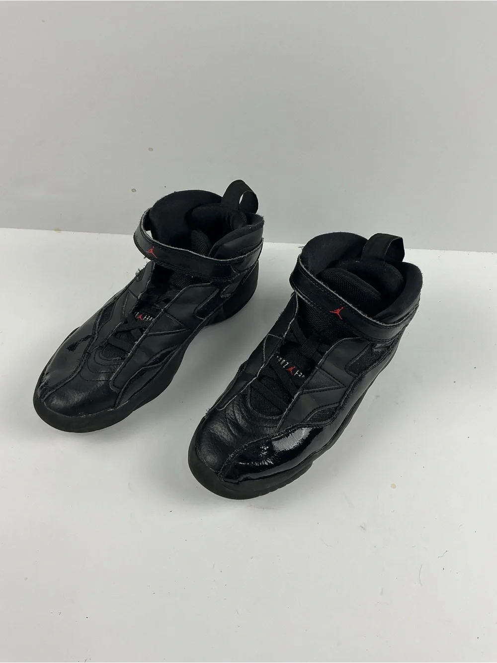 Jordan Black Kids' High-Top Sneakers with Red Jumpman Accents they need inserts